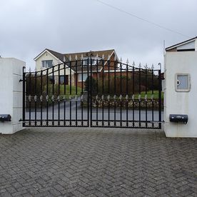 Articulated arm wrought iron gates